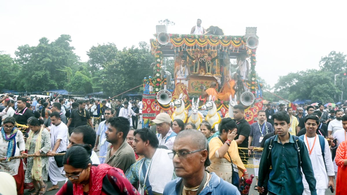 Devotees pull the chariot during the ISKCON Ulta Rath Yatra marking the return…