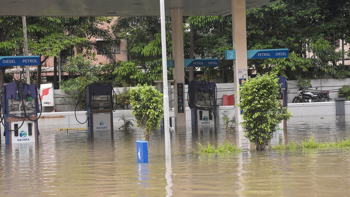 A view of partially submerged Nayara petrol pump premises due to heavy…