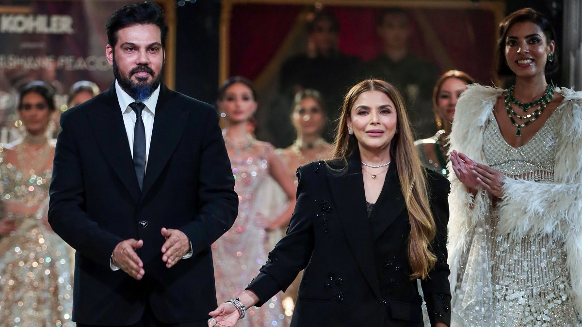 Designer duo Falguni and Shane Peacock walk the ramp at India Couture Week, in…