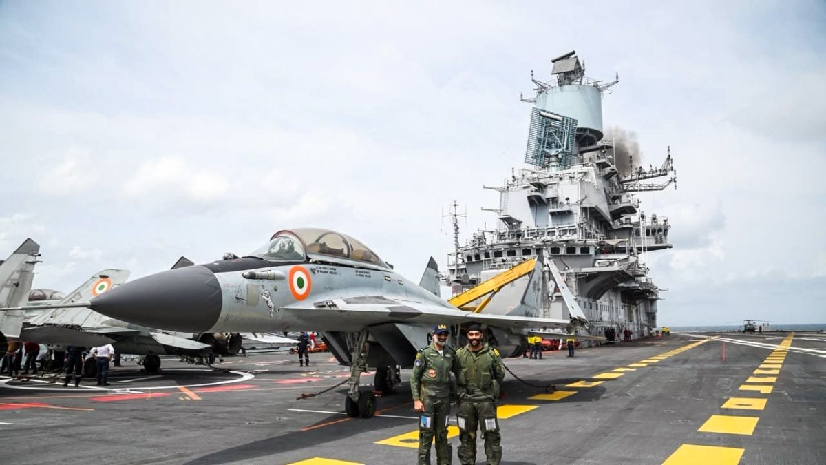 Air Chief Marshal AP Singh poses for a picture in front of MiG-29K fighter jet…