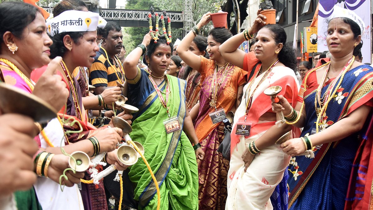 Devotees perform traditional dances and sing Abhanga and Bhajans while…