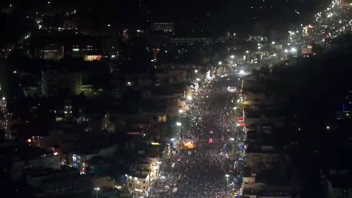 An aerial view shows thousands of devotees gathered to witness the sacred Deva…