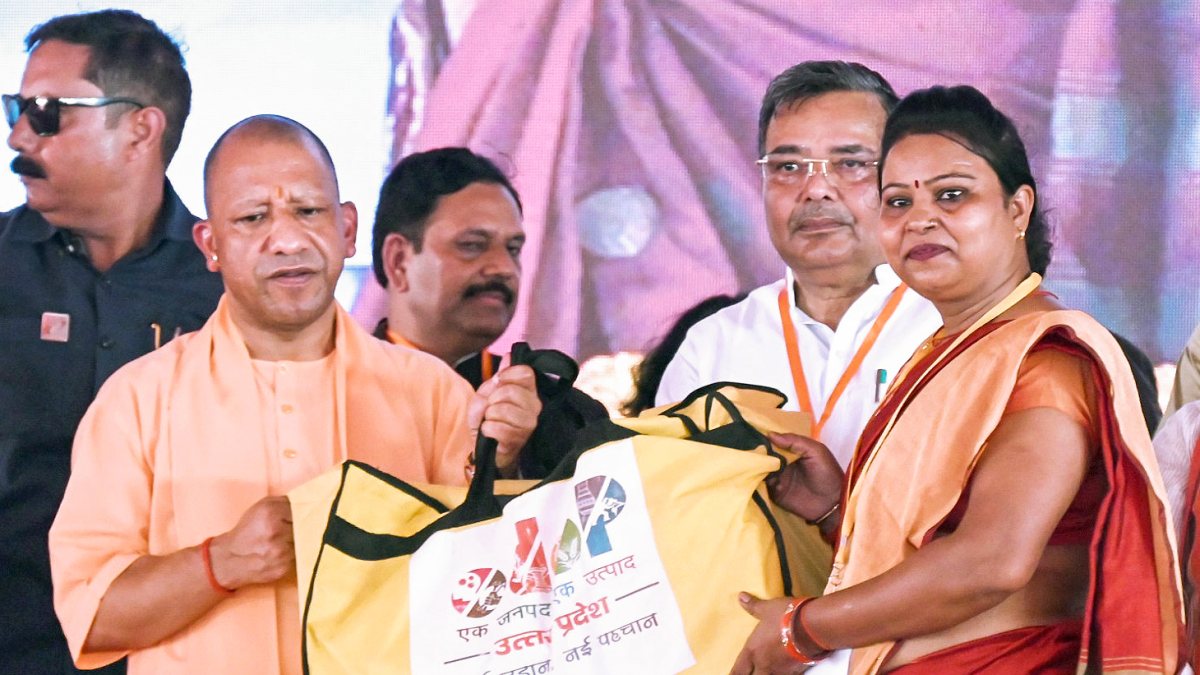 Uttar Pradesh Chief Minister Yogi Adityanath presents a toolkit to a…