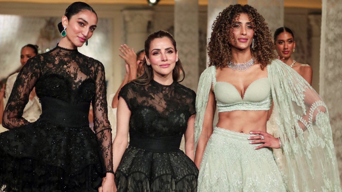 Models walk the ramp on Day 2 of India Couture Week