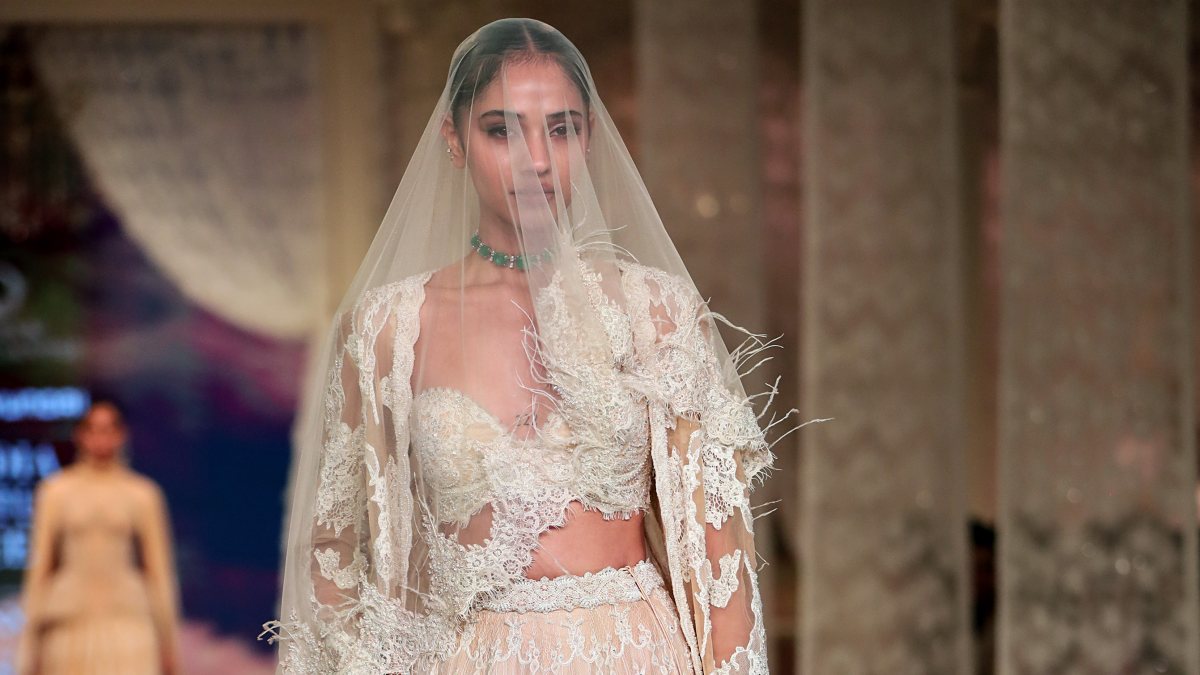 Model walks the ramp on Day 3 of India Couture Week in Delhi