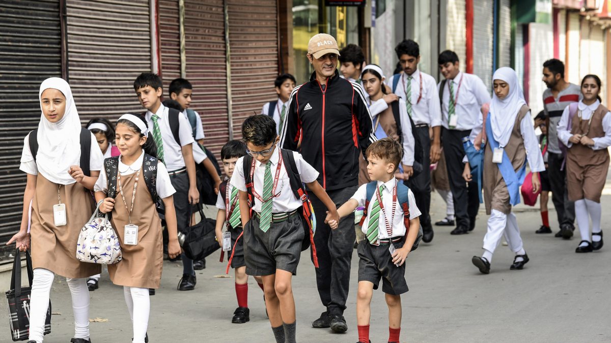 Students return to school after 21-day summer break in Srinagar