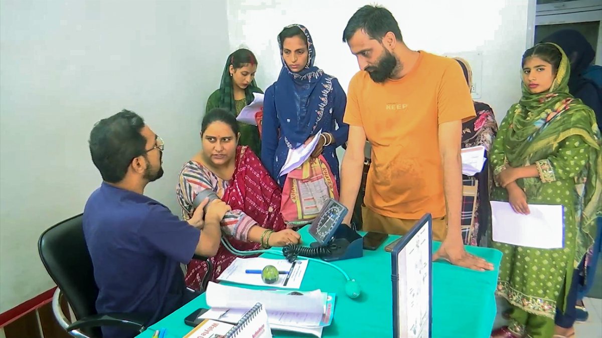 Doctor examines patient at PHC Mogla in Rajouri's hilly terrain