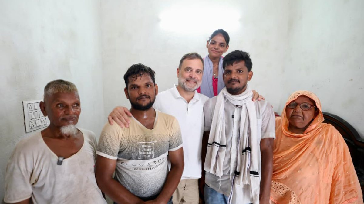 Rahul Gandhi poses with Cockroach Janta Party protester and family