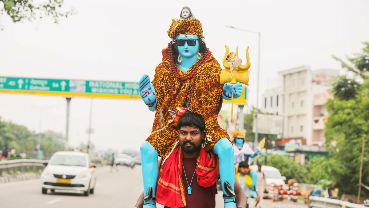 Devotee carries Lord Shiva idol during Kanwar Yatra in Haridwar