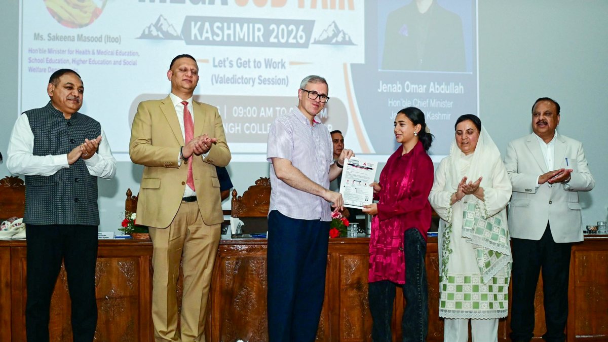 Omar Abdullah hands offer letter to student at mega job fair in Srinagar