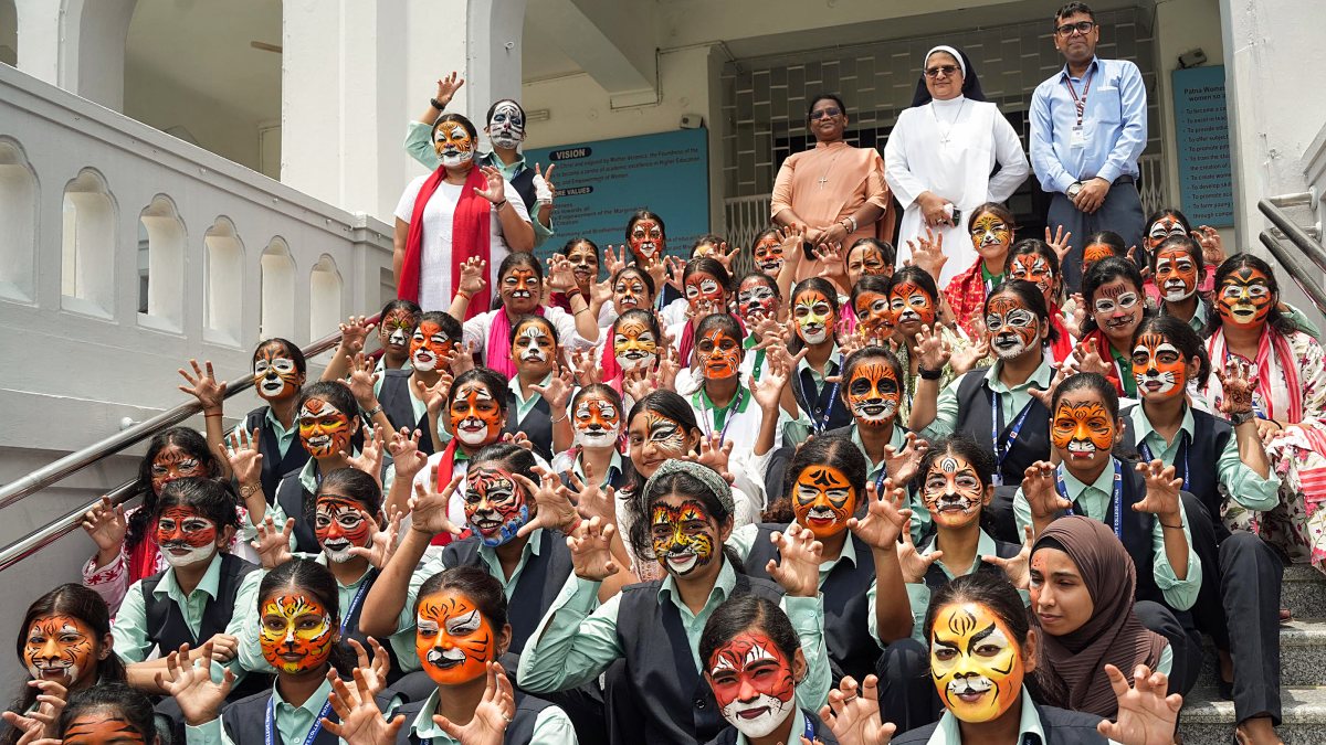 Students face paint for International Tiger Day in Patna