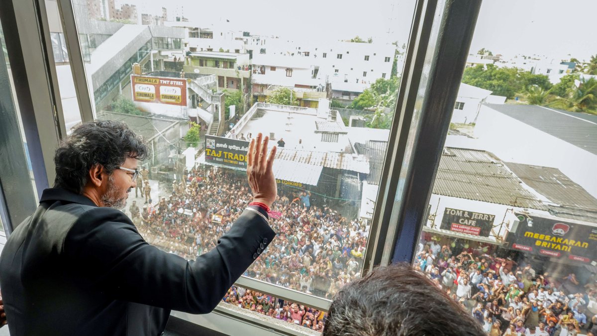Tamil Nadu CM Vijay waves to supporters during Chennai Metro Rail review