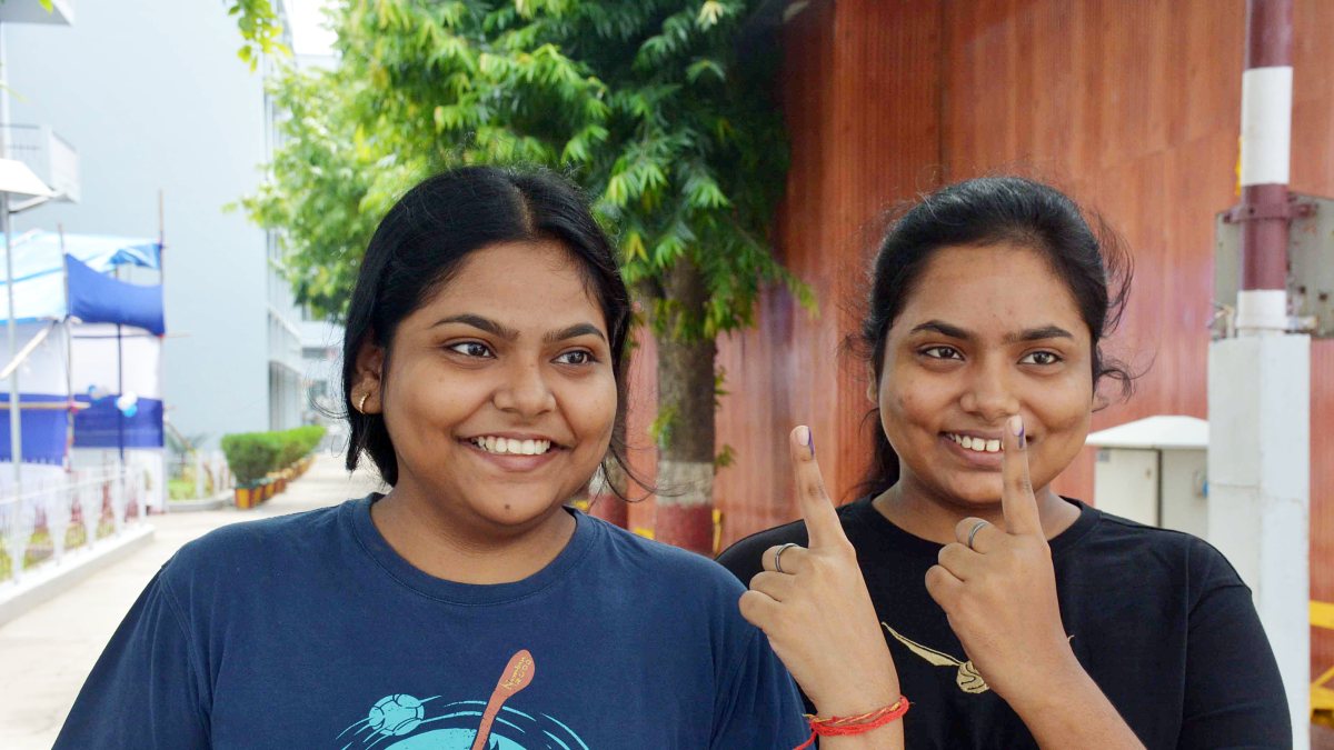 Voters show inked fingers after casting ballots in Bihar bypoll