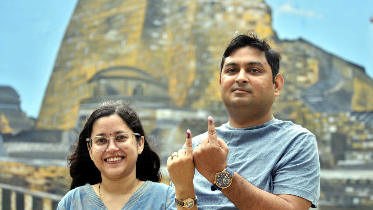 Voters show ink-marked fingers after casting ballots in Bihar bypoll