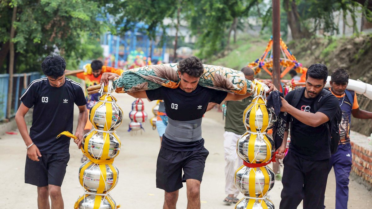 Devotee carries Ganga water in Kanwar during Sawan yatra