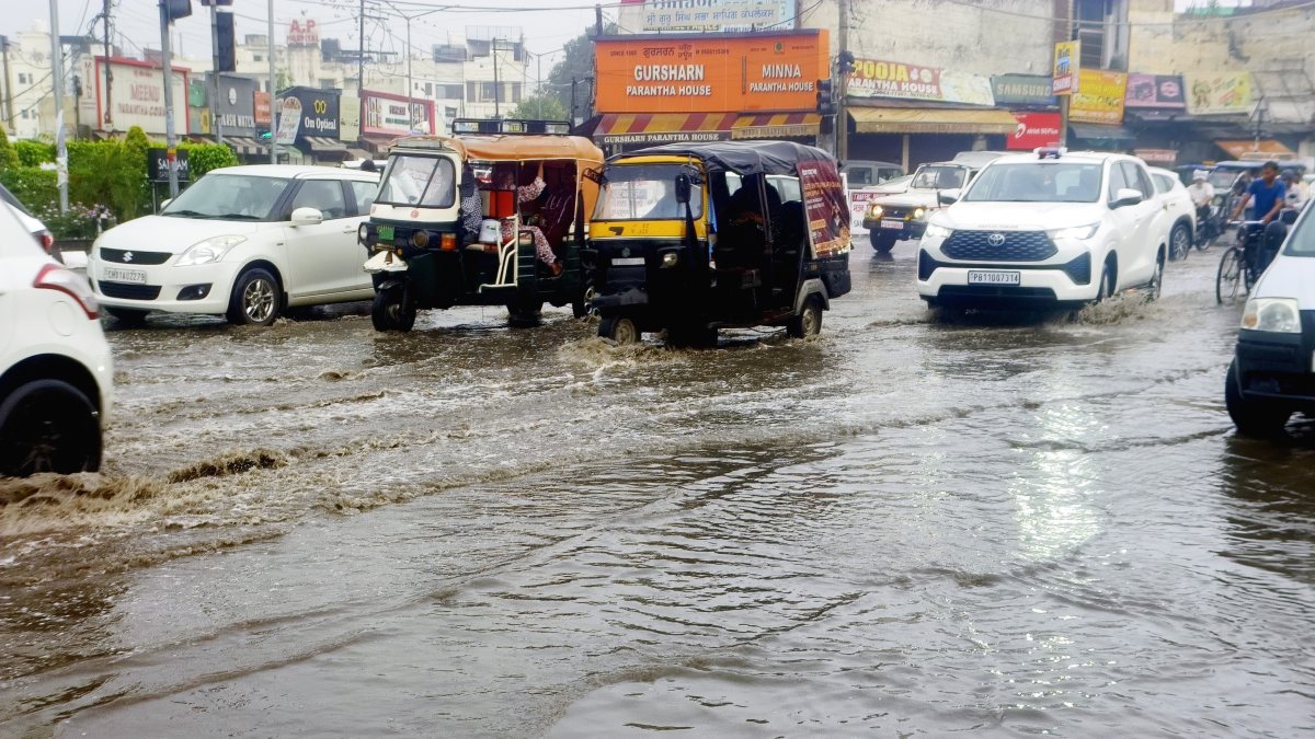 Commuters wade through waterlogged Patiala road after heavy rain