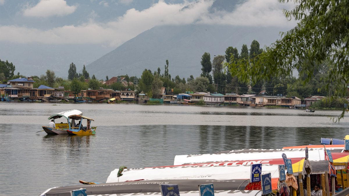 Tourists enjoy shikara ride on Dal Lake as weather improves in Srinagar