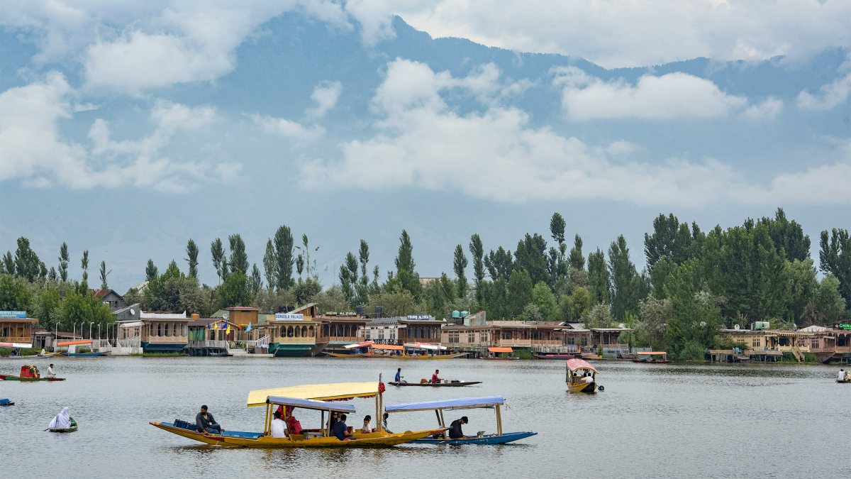 Tourists enjoy shikara ride on Dal Lake as weather improves