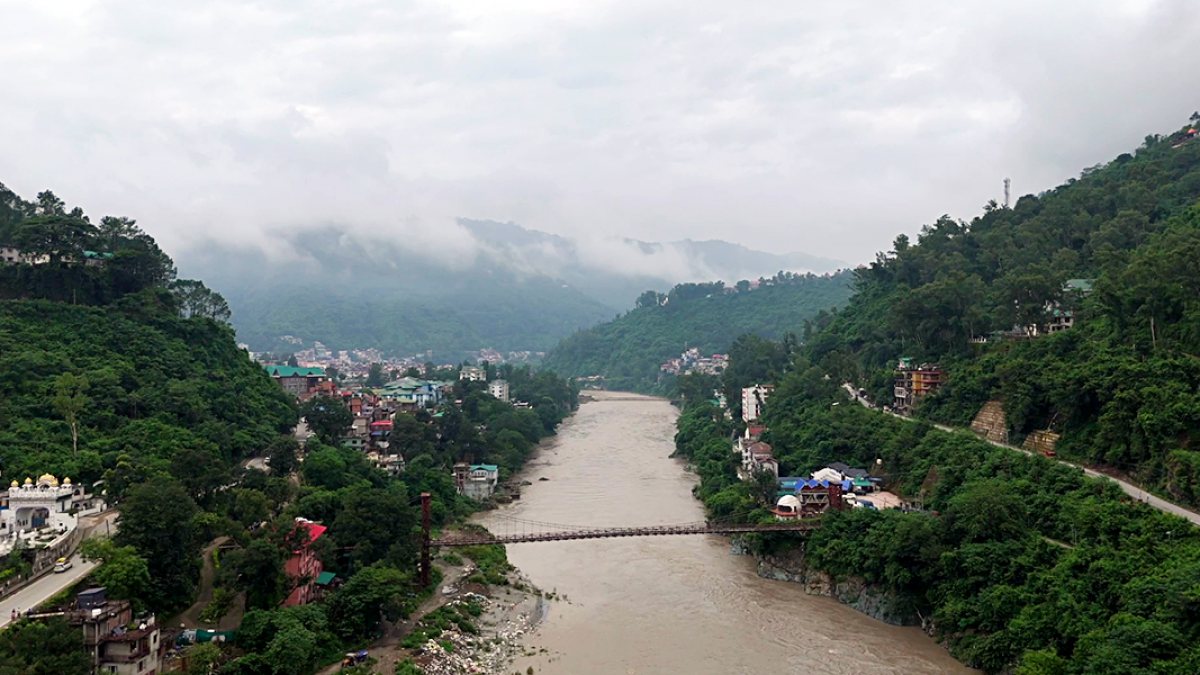 Aerial view of Mandi town along the Beas River amid cloudy weather