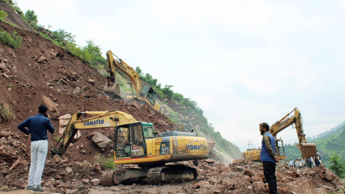 JCBs widen Jammu-Srinagar highway during traffic dry day