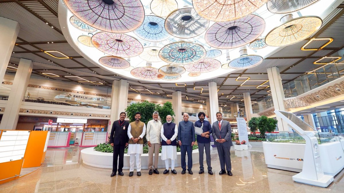 PM Modi poses with Andhra leaders at Bhogapuram airport