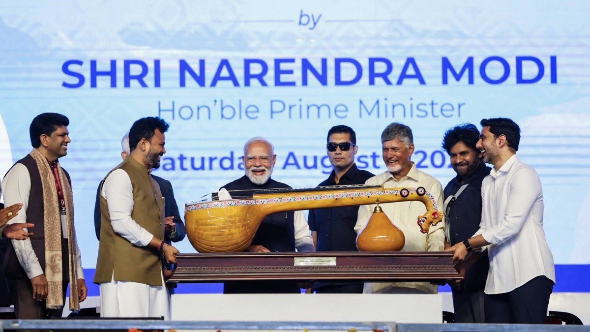 PM Modi receives Bobbili Ekanda Veena at Bhogapuram airport
