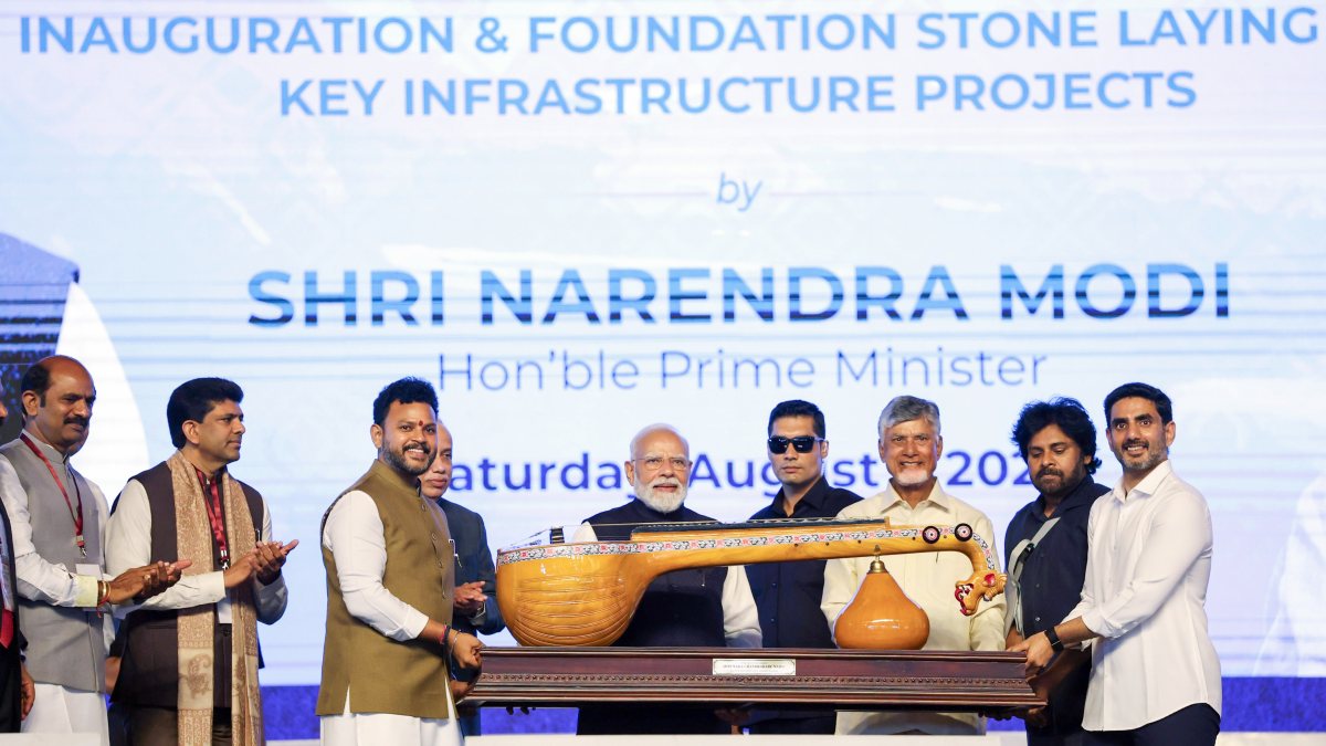 PM Modi receives Bobbili Ekanda Veena at Bhogapuram airport