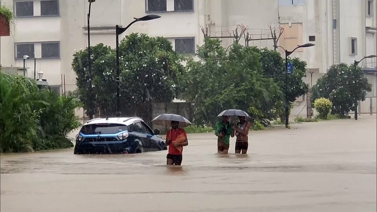 Heavy rains flood Surat streets, residents wade through water