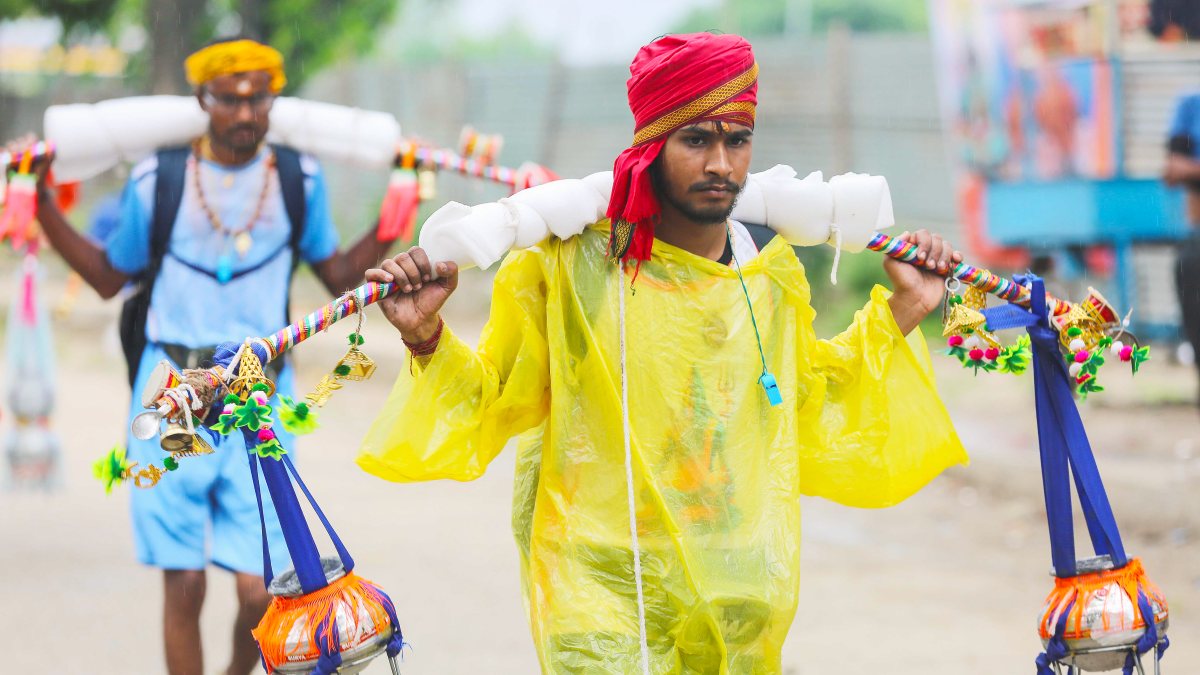 Devotee carries Ganga water during Kanwar Yatra in Haridwar
