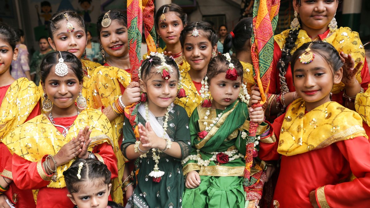 Students in traditional attire celebrate Teej in Amritsar