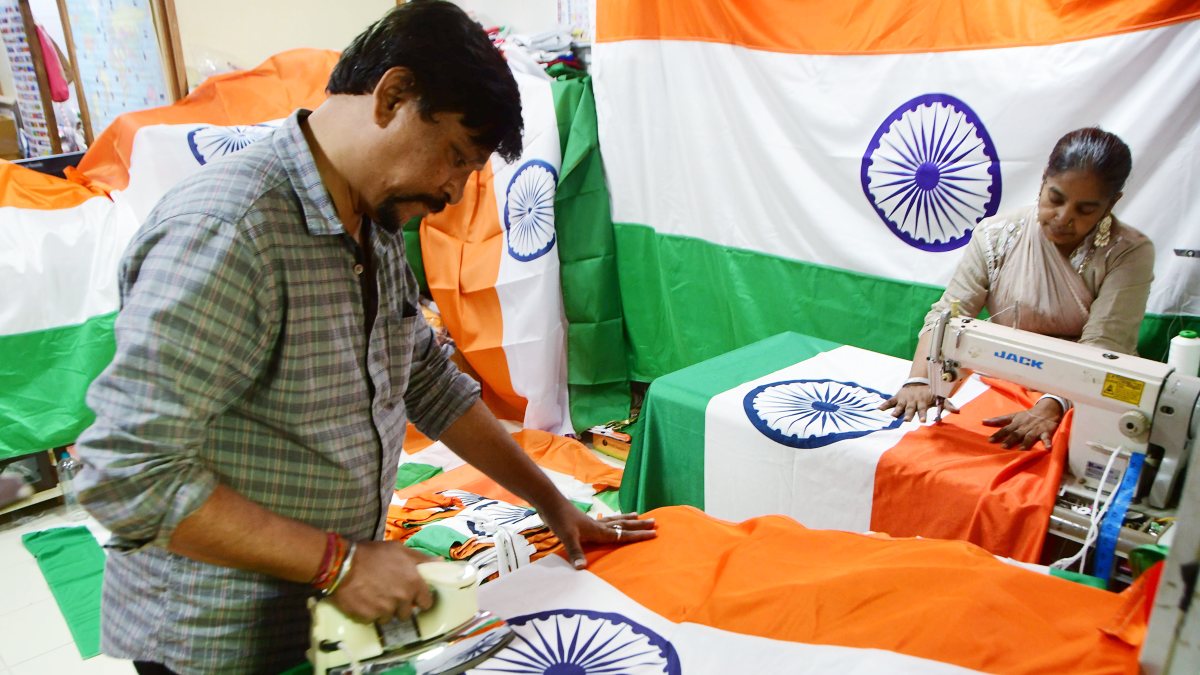 Workers put final touches on tricolours ahead of Independence Day
