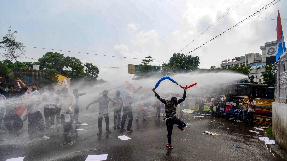 NSUI supporters drenched by water cannon during Patna protest