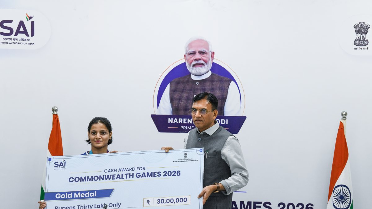 Mansukh Mandaviya presents Rs 30 lakh cheque to CWG gold medallist Asmita Dey