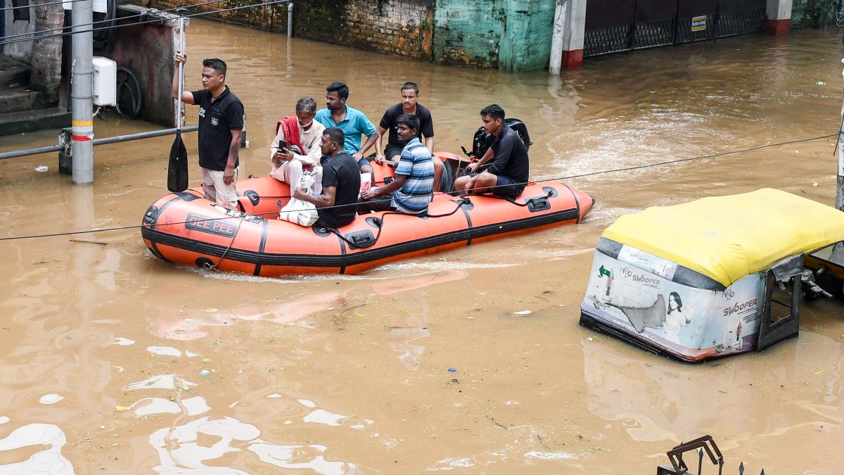 SDRF, Civil Defence rescue residents from flooded Guwahati locality
