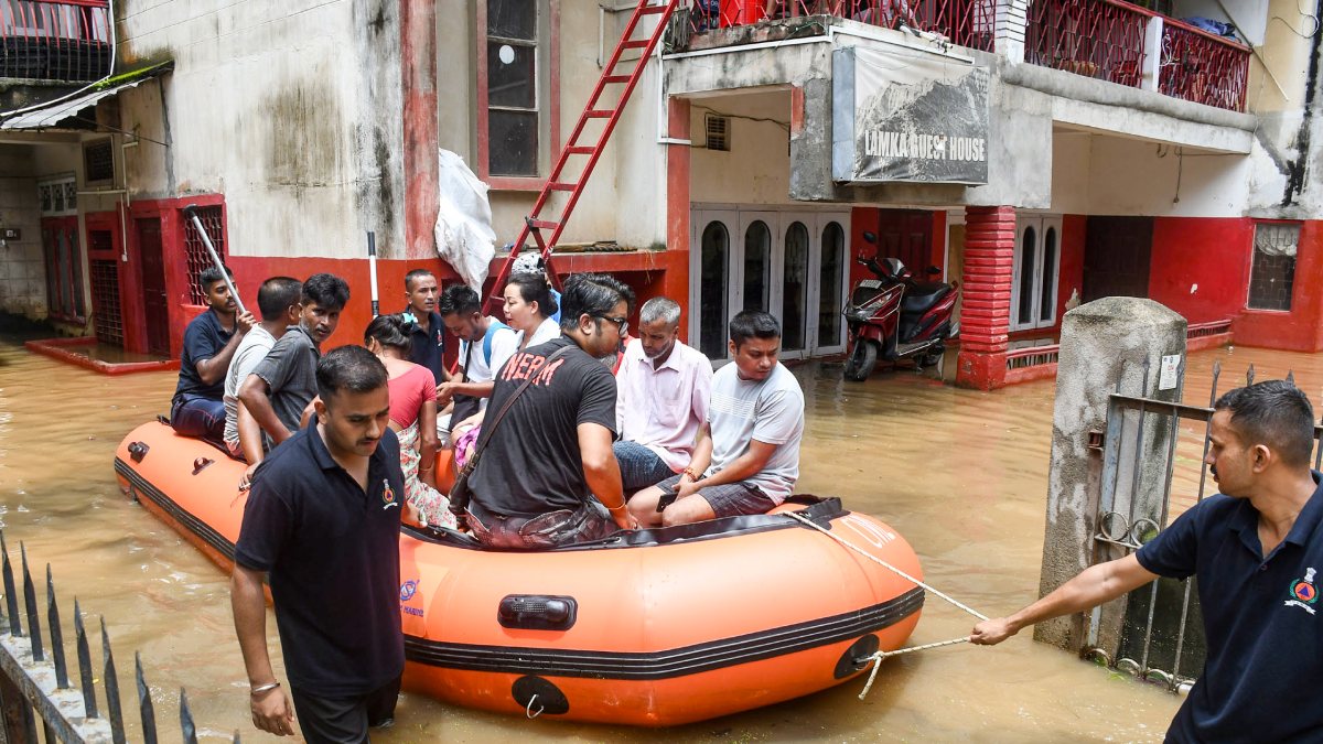 Rescuers evacuate residents from flooded Guwahati locality