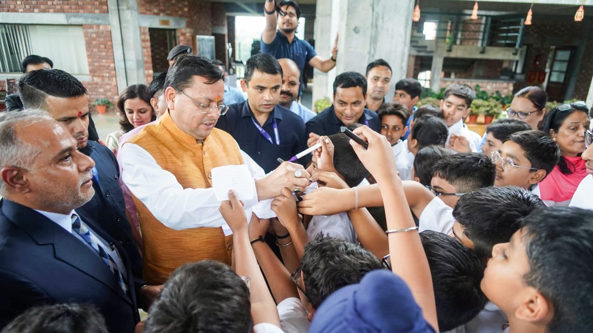 Uttarakhand CM Dhami signs autographs for children at Purukul event