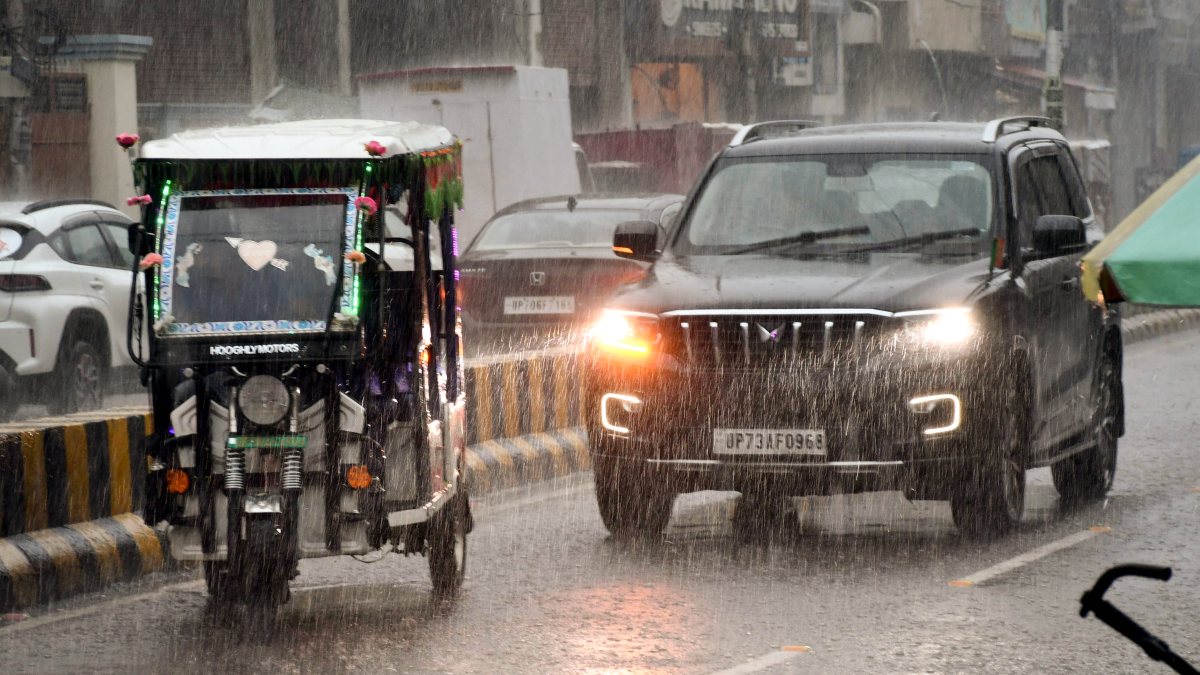 Rain lashes Prayagraj, commuters navigate waterlogged roads
