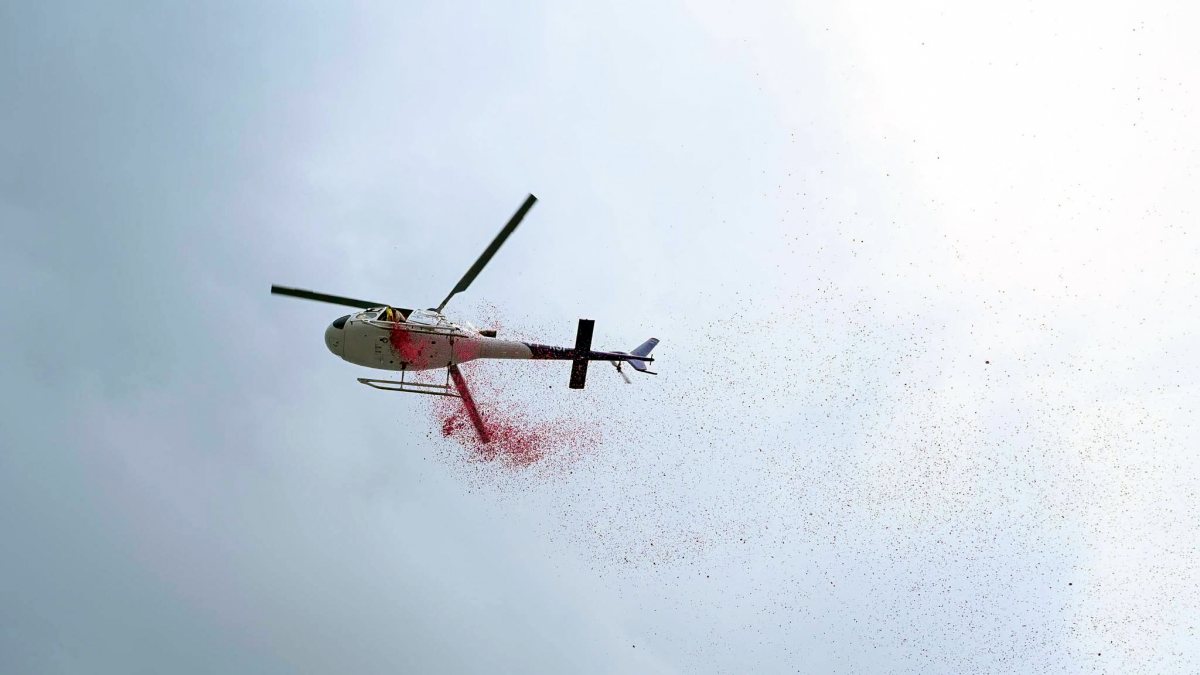 Helicopter showers flower petals on Kanwariyas in Haridwar