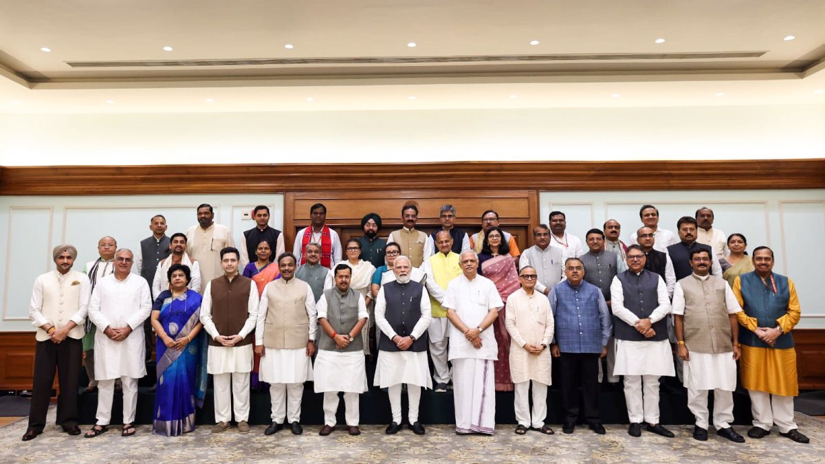 Modi poses with newly elected BJP Rajya Sabha MPs in Delhi