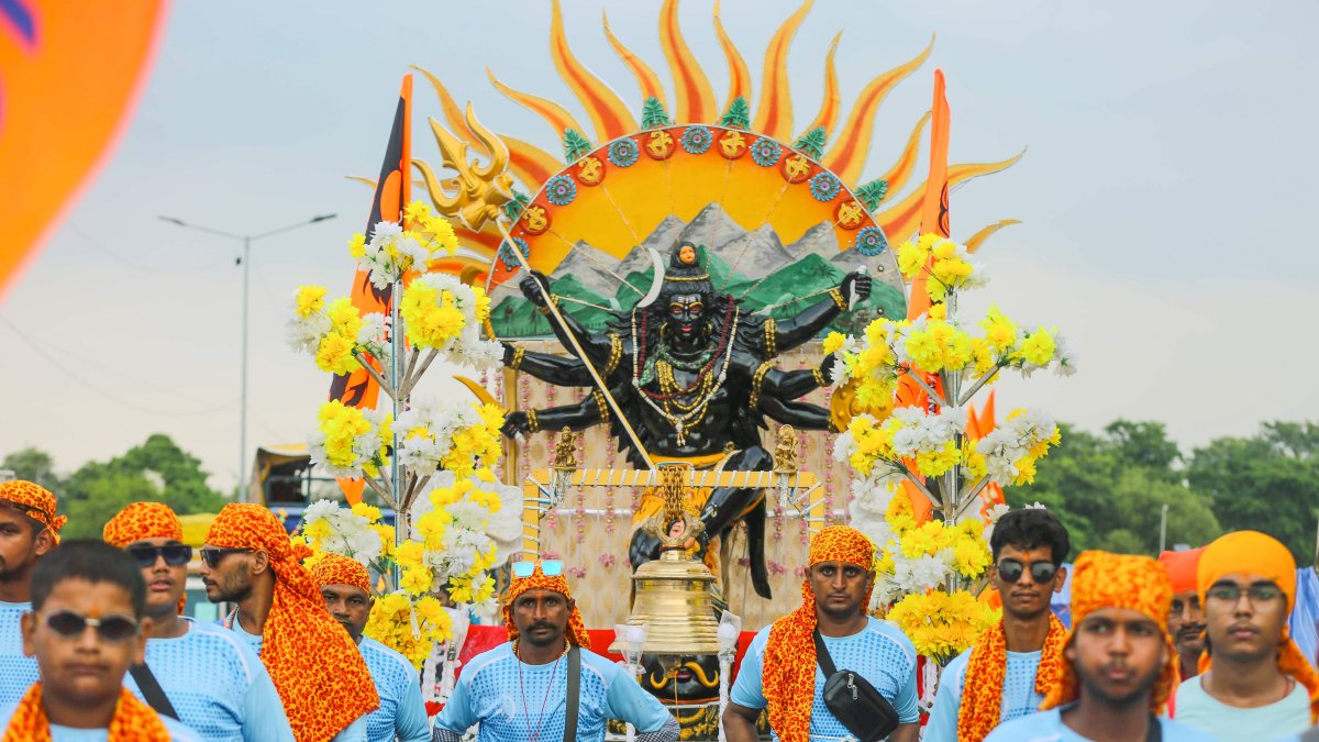 Devotees carry decorated kanwar during Kanwar Yatra in Haridwar