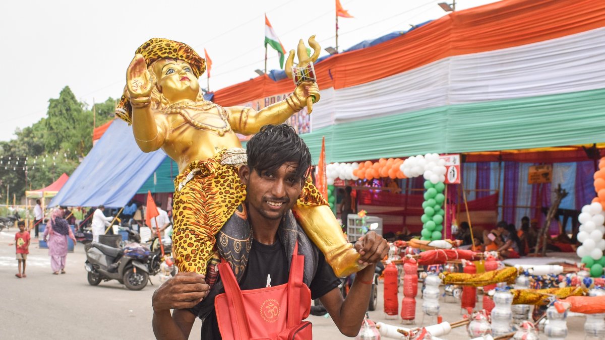 Kanwariya carries Lord Shiv idol during Kanwar Yatra in Ghaziabad