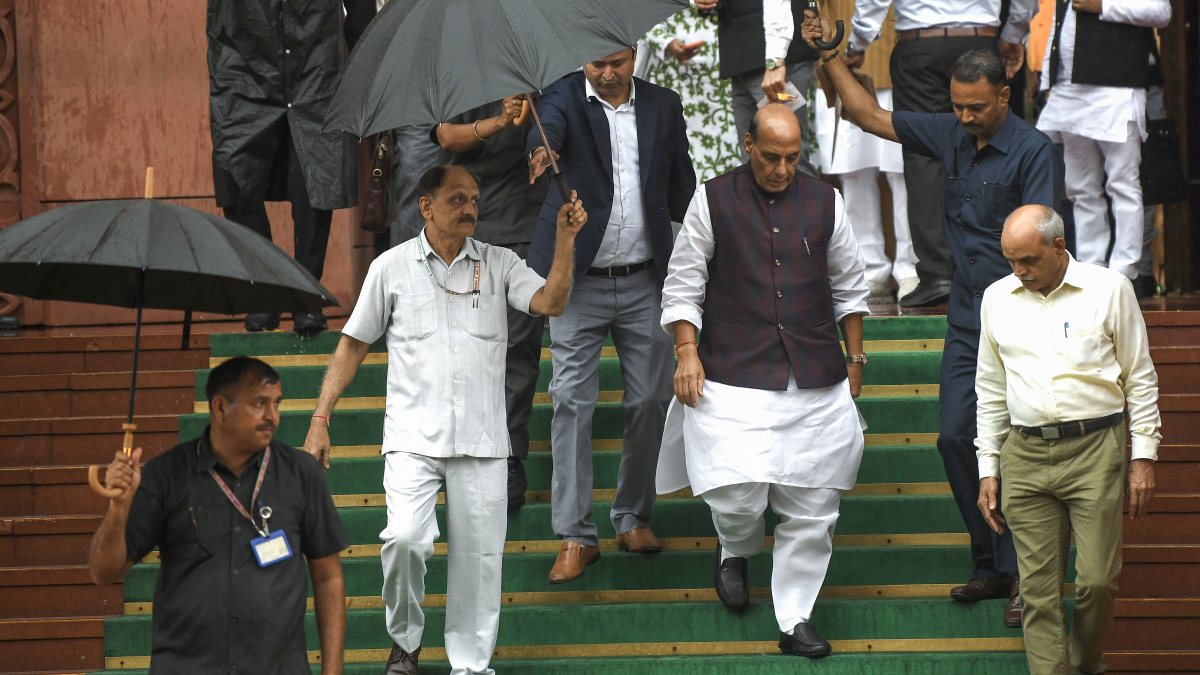 Rajnath Singh leaves Parliament amid monsoon rain