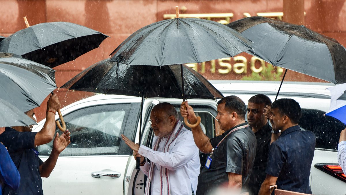 Amit Shah arrives at Parliament amid monsoon rain