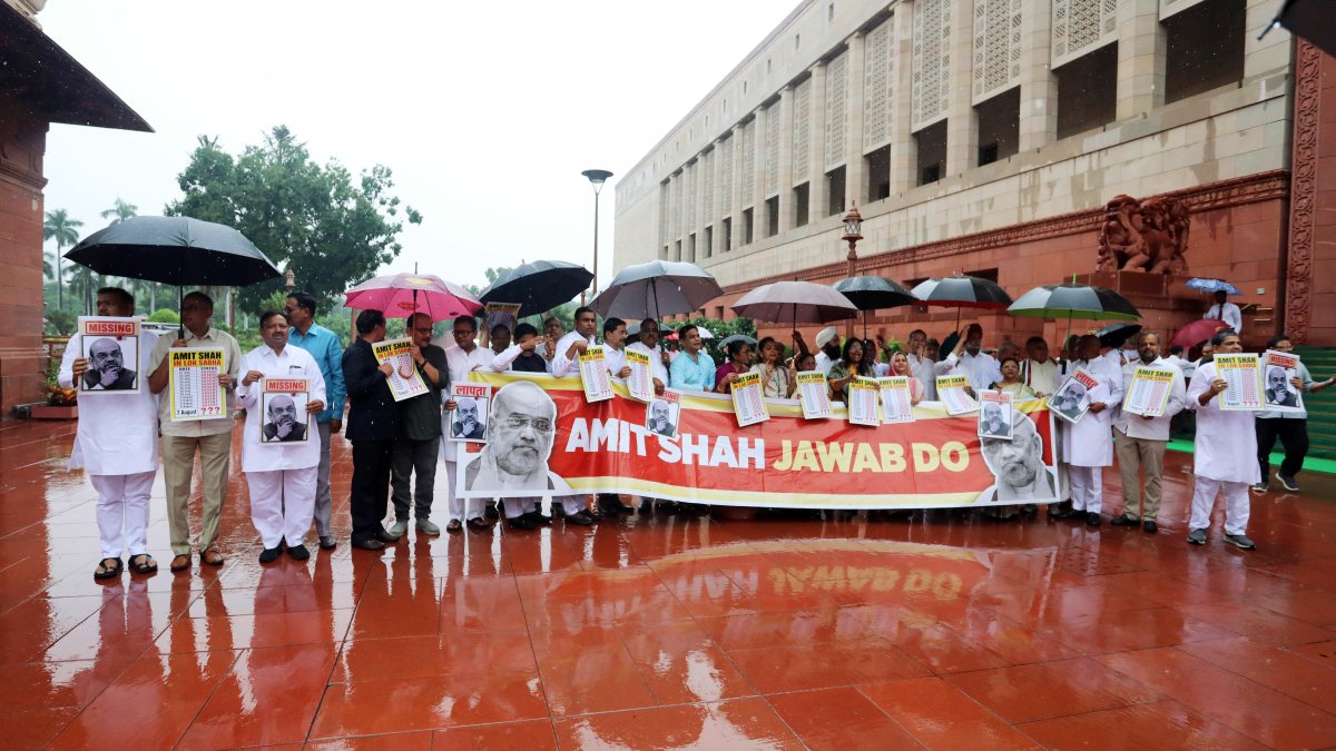 Opposition MPs protest at Parliament amid rain over key issues