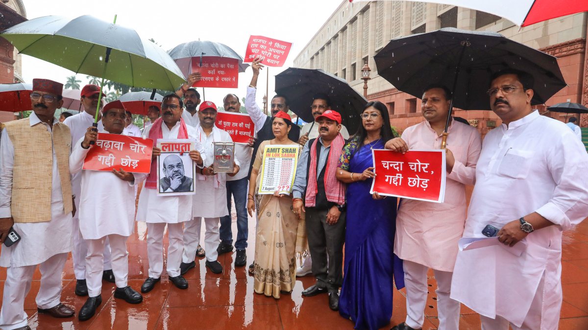 Opposition MPs protest at Parliament amid rain over key issues