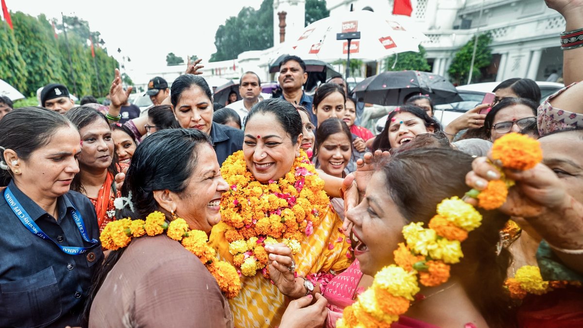 Delhi CM Rekha Gupta garlanded by women supporters outside Assembly