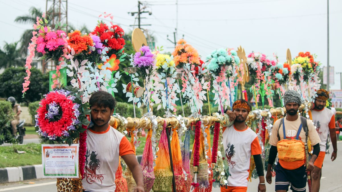 Devotees carry flower-adorned Kanwar during Meerut yatra