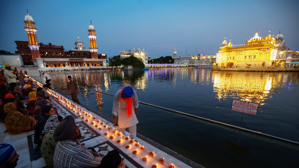 Devotees light lamps at Golden Temple on Guru Harkrishan birth anniversary