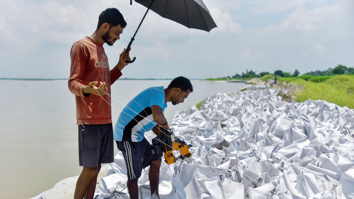Workers prepare geo bags to prevent Brahmaputra erosion in Kamrup