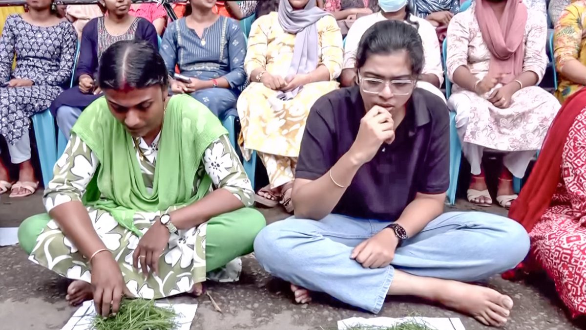 Kerala teacher rank holders eat grass in PSC protest